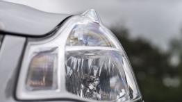 Nissan Almera 2013 - lewy przedni reflektor - wyłączony