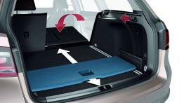 Volkswagen Passat B7 kombi (2011) - schemat działania uchwytu do składania tylnej kanapy