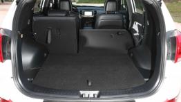 Kia Sportage III Facelifting (2014) CRDi 16V - tylna kanapa złożona, widok z bagażnika