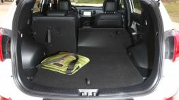 Kia Sportage III Facelifting (2014) CRDi 16V - tylna kanapa złożona, widok z bagażnika