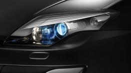 Renault Laguna Hatchback 2011 - lewy przedni reflektor - włączony