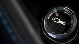 Aston Martin V12 Vantage S (2013) - przycisk do regulacji zawieszenia