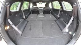 Kia Carens IV 1.6 GDI 135KM - galeria redakcyjna - tylna kanapa złożona, widok z bagażnika